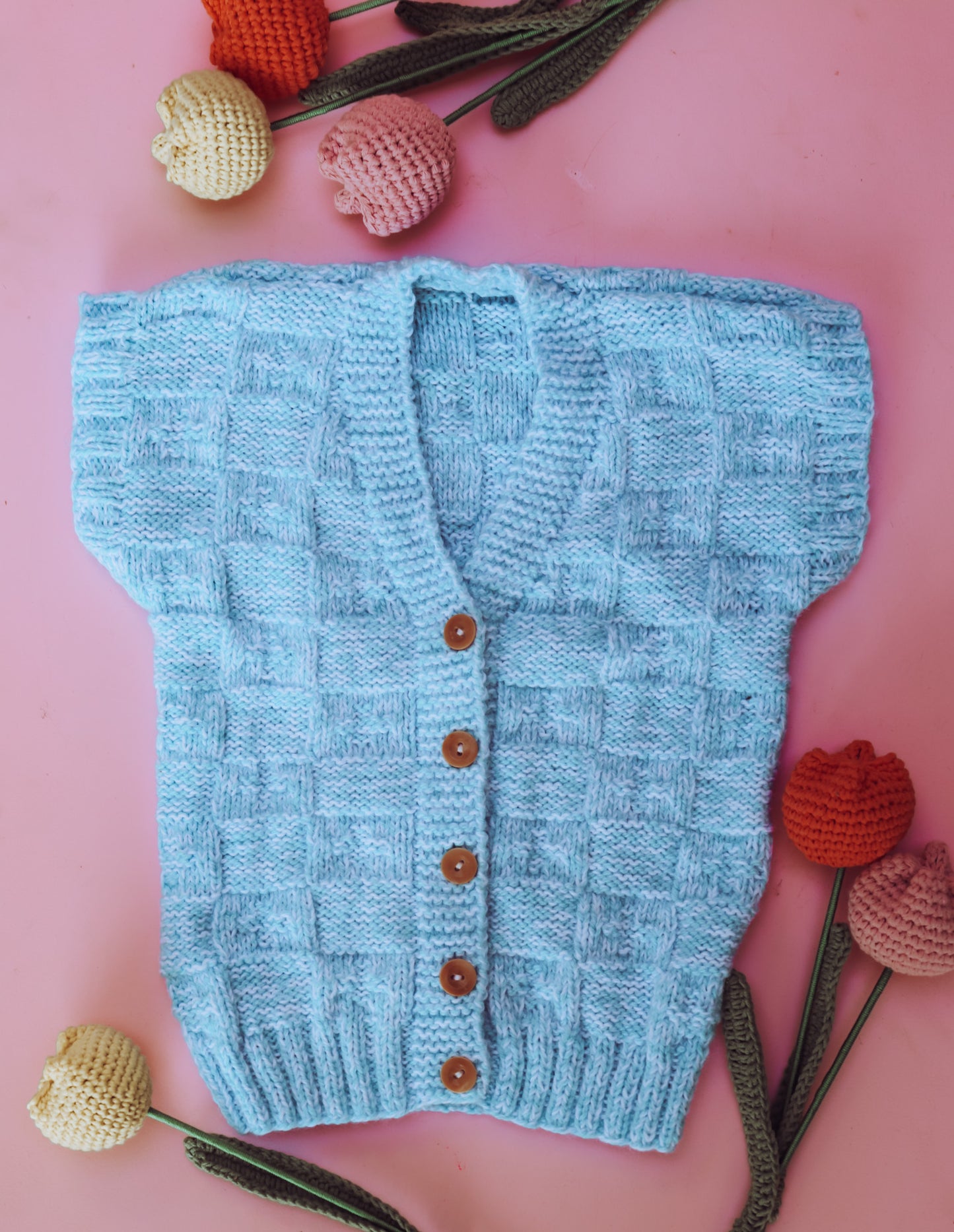 Hand knitted blue square vest