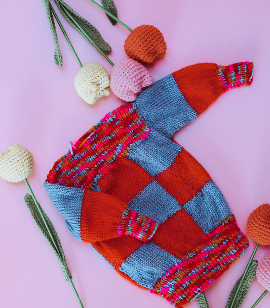 Hand knitted rainbow square